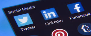 what is social media marketing, social media marketing, picture of twitter linkedin facebook pinterest icons on a screen for social media marketing