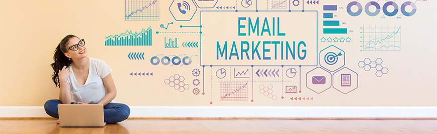 women sitting on floor looking at a poster with email marketing on it