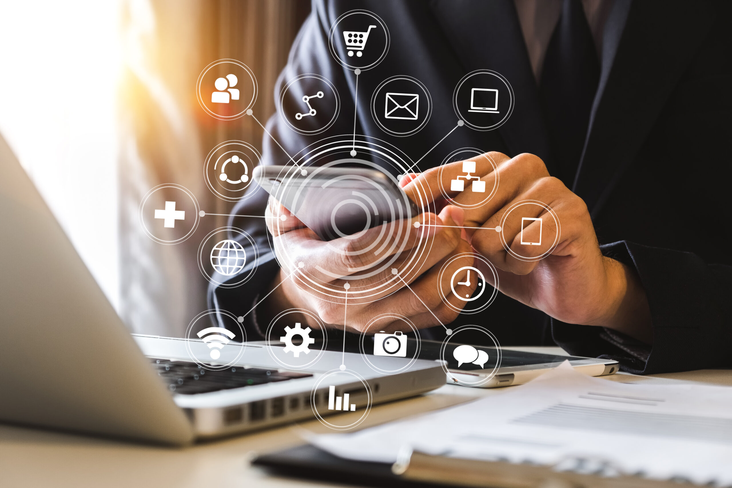 Digital marketing media in virtual screen.businesswoman hand working with mobile phone and modern compute with VR icon diagram at office in morning light SEO PPC GEO