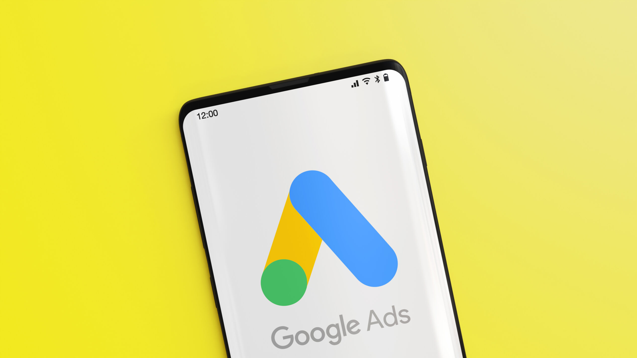 Mobile phone with the Google Ads logo displayed. 3D rendering. Attribution Models for Google Ads